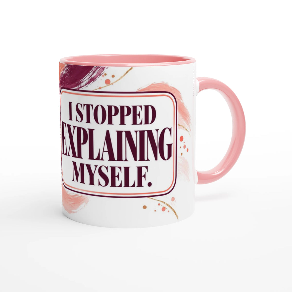 Stopped Explaining 11 oz ceramic mug with a pink handle and plum and coral brush strokes, handle on the right