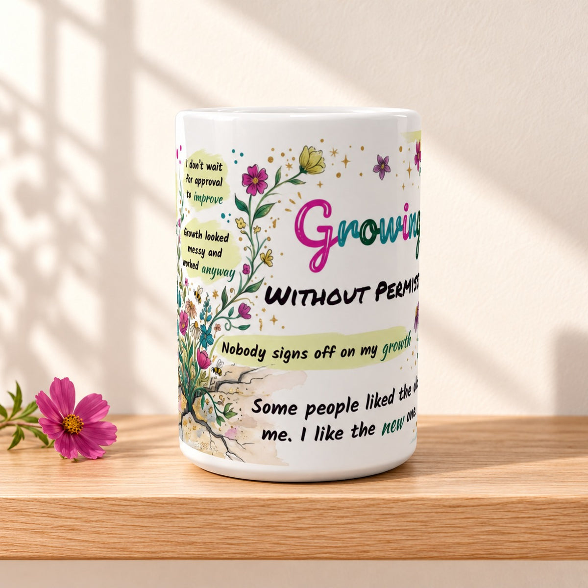 Growing Without Permission 15 oz white ceramic mug resting on a light oak shelf against a warm cream wall